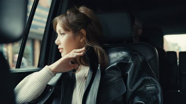 Woman wearing a clearly visible black leather jacket