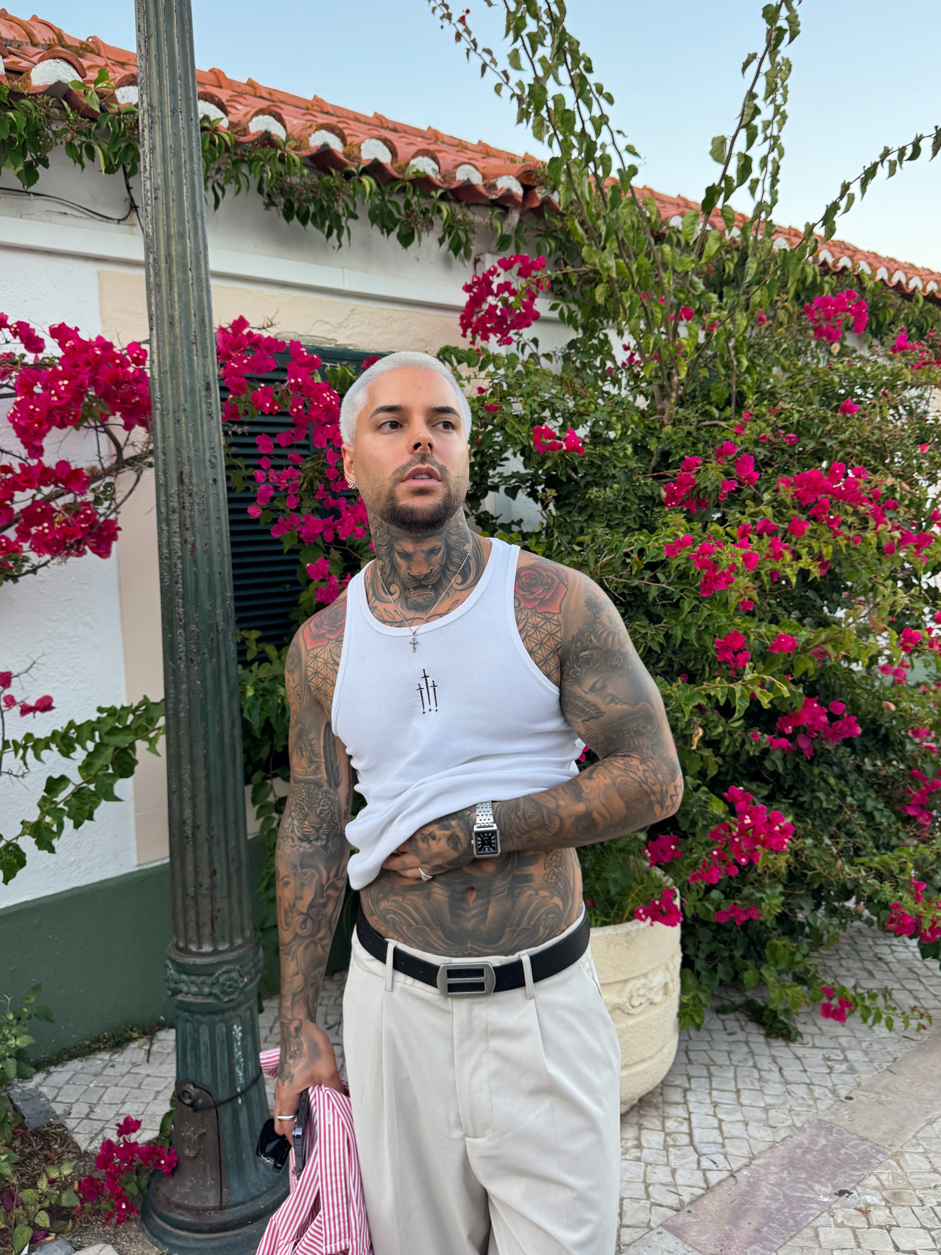 Man wearing a clearly visible white sleeveless top