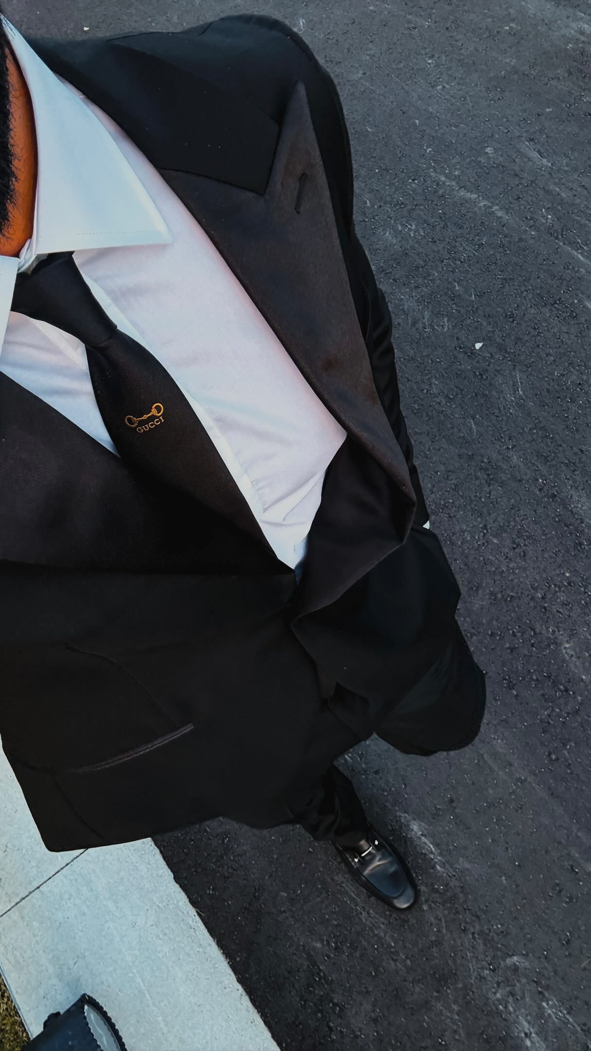 Man wearing clearly visible black tailored trousers