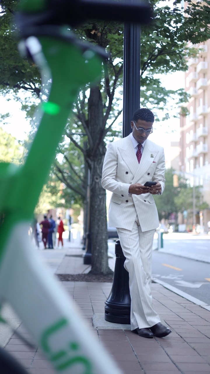 Man wearing tailored outerwear in a polished menswear outfit